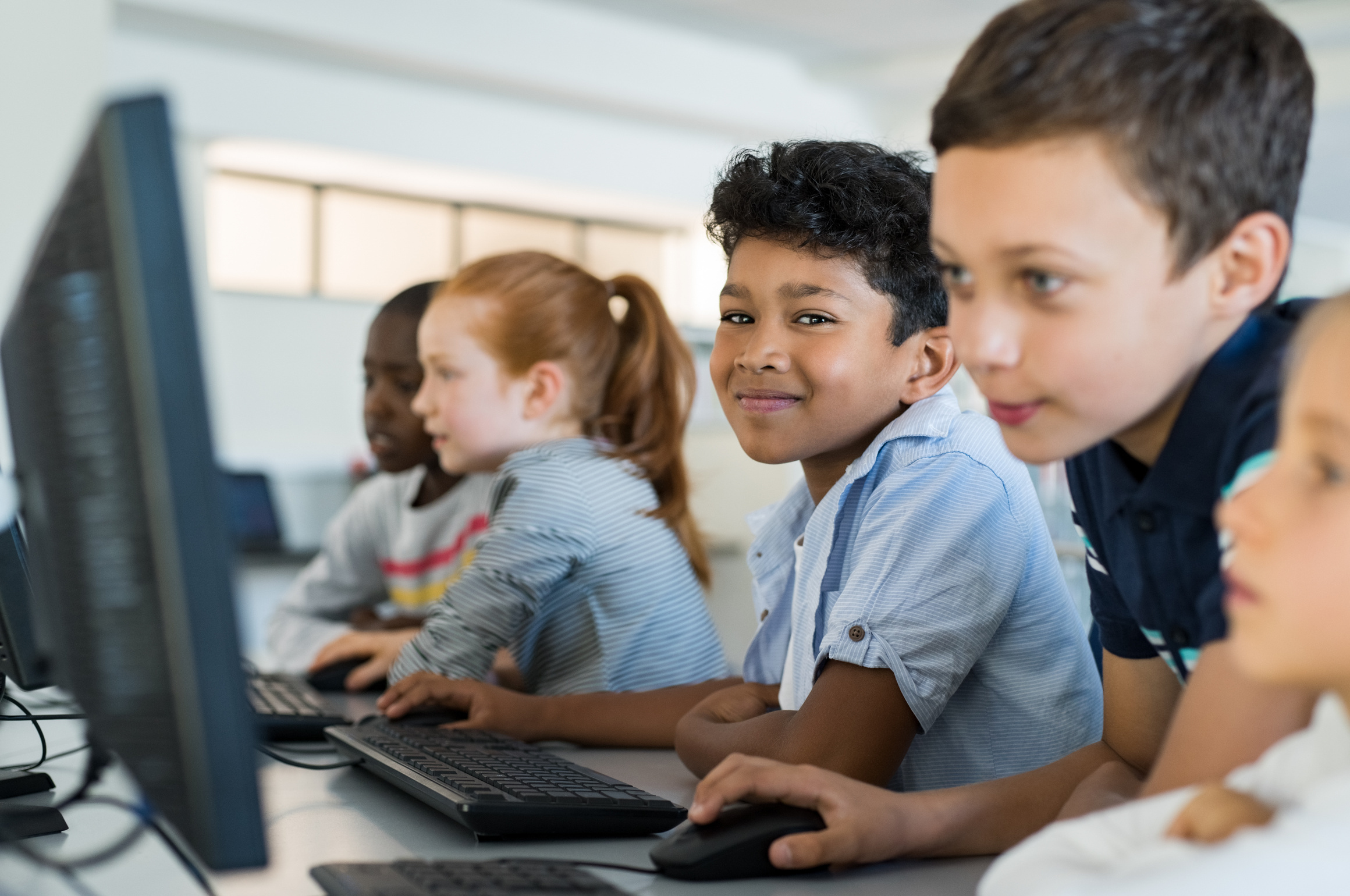 Pupils learning together using classroom technology